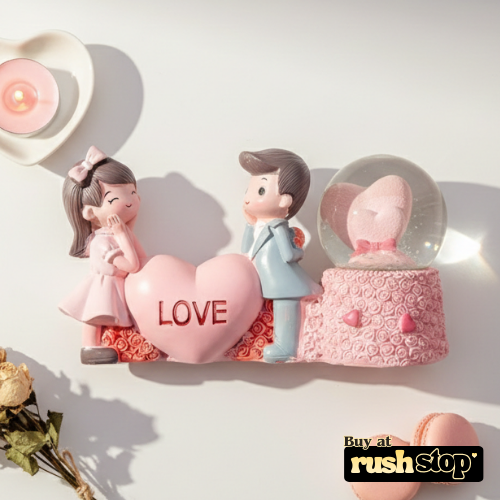 Decorative wall art with a couple and a heart, featuring a 'Love' text, on a light background.