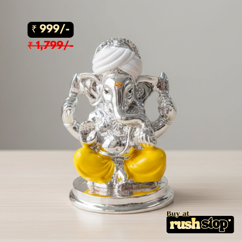 Silver and yellow Ganesh statue with price and brand information on a gray background