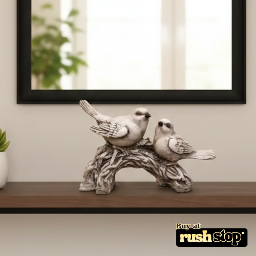 Vintage-style white bird decor statue on branch for farmhouse and cottage interiors