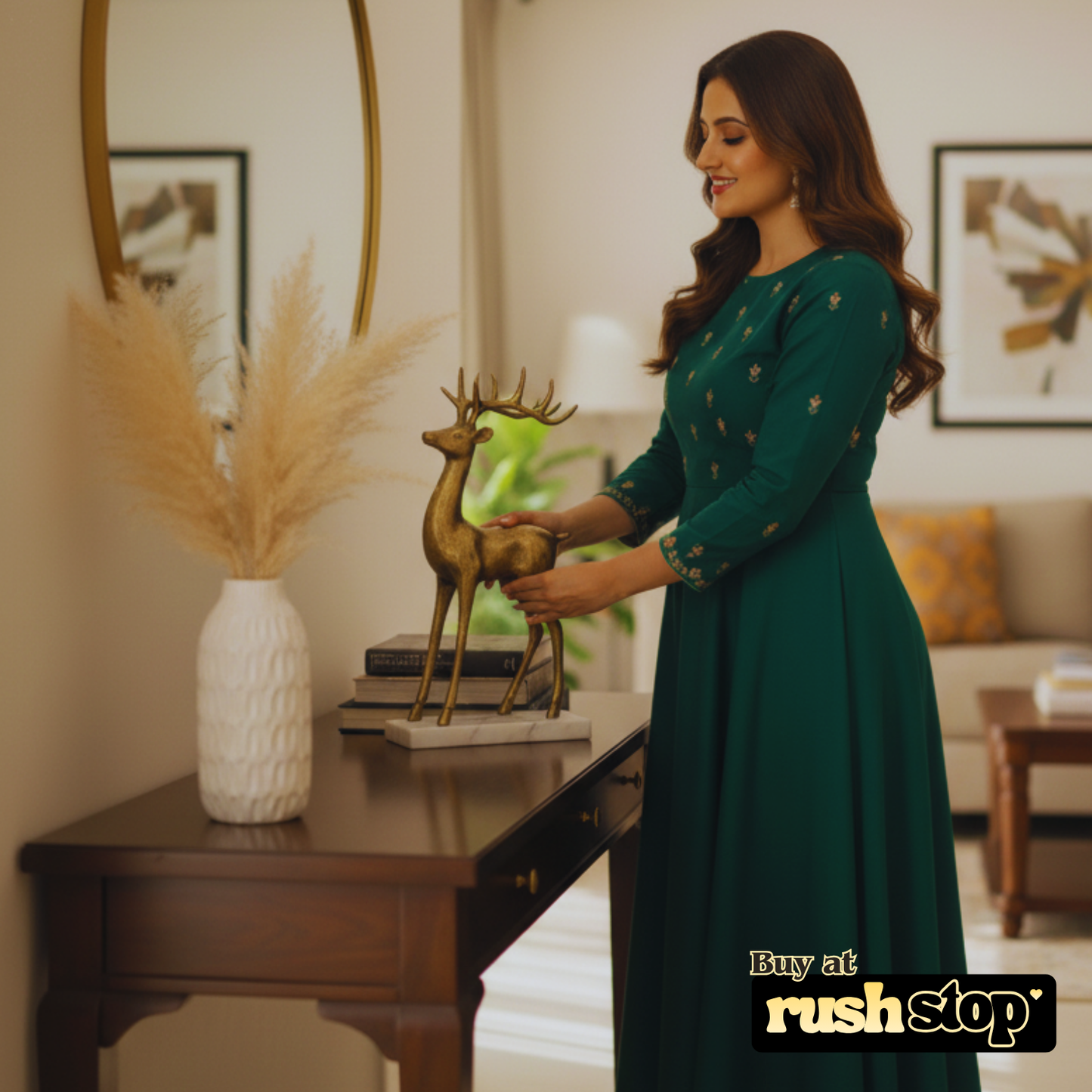 Woman in a green dress arranging Brass Reindeer decor