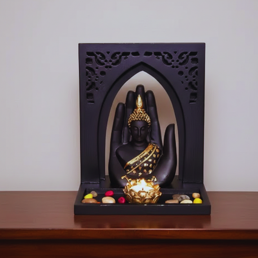 Decorative piece with Buddha statue in a black frame on a wooden surface