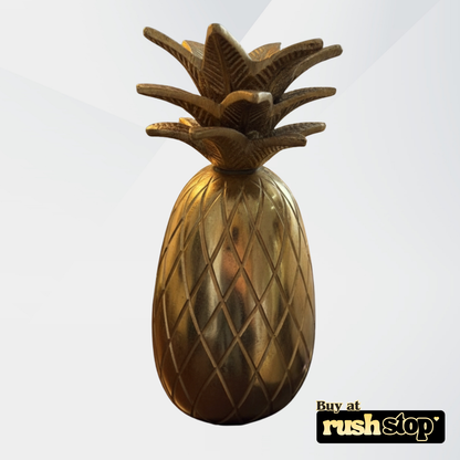 Golden pineapple table decor from Rush Stop, suited for modern resin figurine and handcrafted decor India setups.