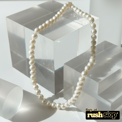 Handcrafted natural freshwater pearl necklace with creamy ivory 9mm pearls and gold-toned barrel clasp