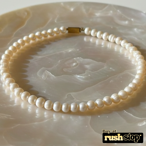 Handcrafted natural freshwater pearl necklace with creamy ivory 9mm pearls and gold-toned barrel clasp