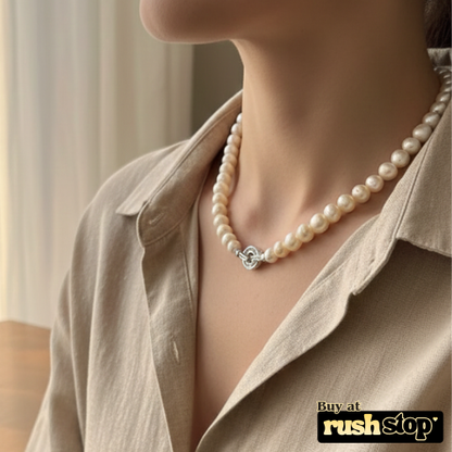 Handcrafted natural freshwater pearl necklace with creamy ivory 10mm pearls and gold-toned barrel clasp