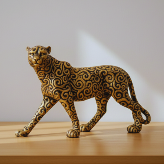 Decorative figurine of a leopard on a wooden surface with a neutral background