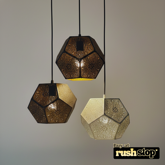 Three geometric pendant lights hanging against a plain background with 'rushstop' branding.