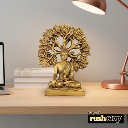Golden meditating Buddha statue under Bodhi tree decor