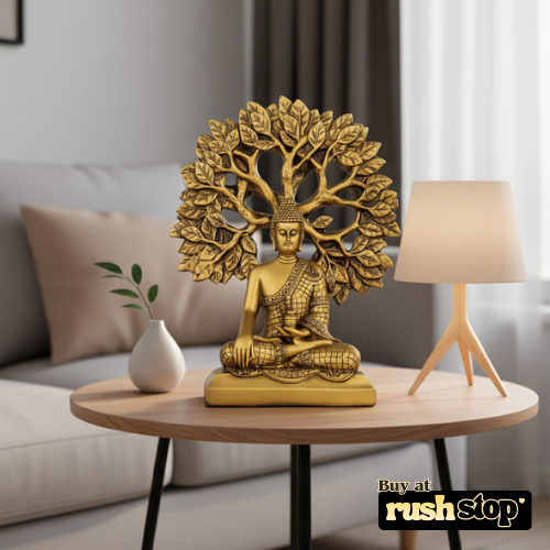 Golden meditating Buddha statue under Bodhi tree decor