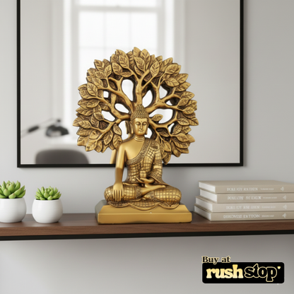 Golden meditating Buddha statue under Bodhi tree decor