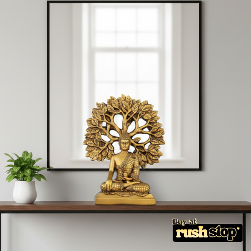 Golden meditating Buddha statue under Bodhi tree decor