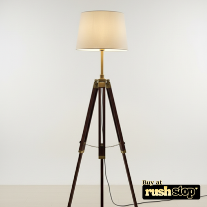 Tripod floor lamp with a beige shade on a white background, featuring 'rushstop' branding.