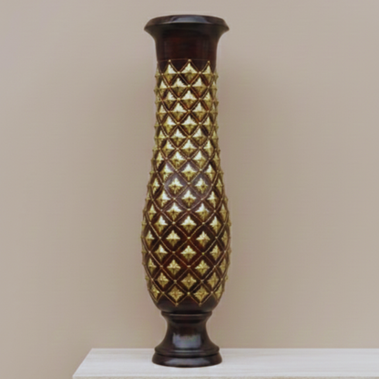 Decorative vase with gold geometric pattern on a beige background