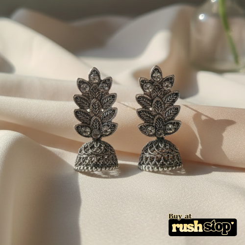 Antique oxidized silver leaf pattern jhumka earrings with crystal accents and bell shaped dangler