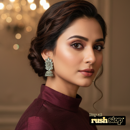 Antique oxidized silver leaf pattern jhumka earrings with crystal accents and bell shaped dangler