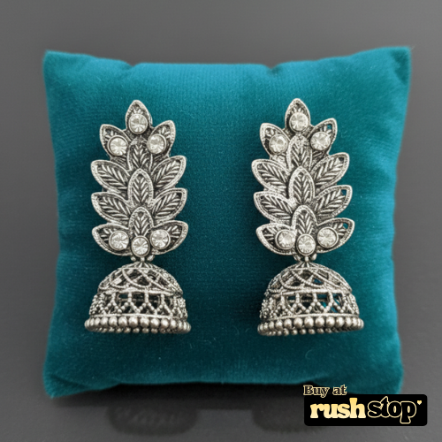 Antique oxidized silver leaf pattern jhumka earrings with crystal accents and bell shaped dangler