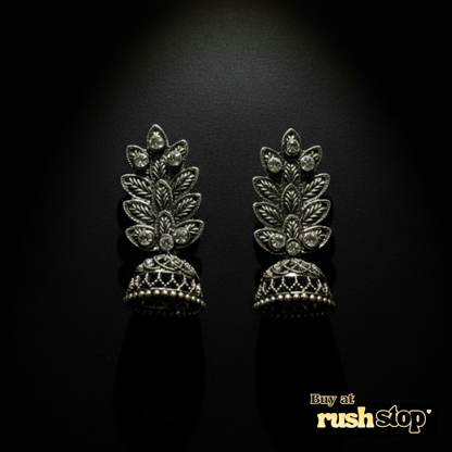 Antique oxidized silver leaf pattern jhumka earrings with crystal accents and bell shaped dangler