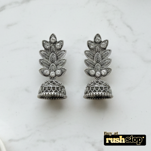 Antique oxidized silver leaf pattern jhumka earrings with crystal accents and bell shaped dangler