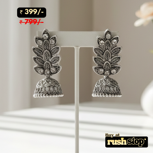 Antique oxidized silver leaf pattern jhumka earrings with crystal accents and bell shaped dangler