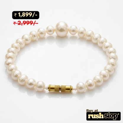 Artisan hand-knotted natural freshwater pearl bracelet featuring a prominent central Baroque pearl and gold-toned barrel clasp.