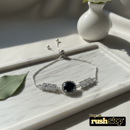 Black onyx crystal bolo bracelet with silver toned adjustable slider chain
