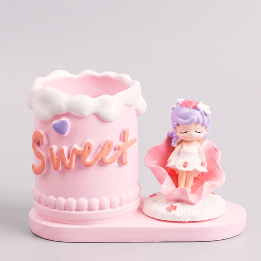 Pink candy-themed figurine with a character and 'Sweet' text on a light gray background