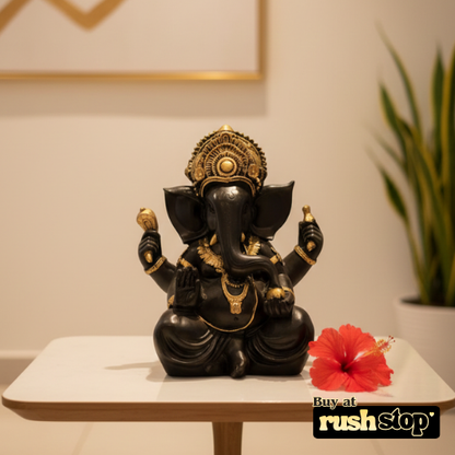 Close up of Ganesha idol showing intricate crown and antique gold jewelry details