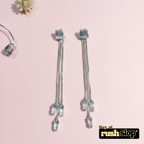 Long chain crystal drop earrings with cascading snake chains and clear baguette crystals by Veera