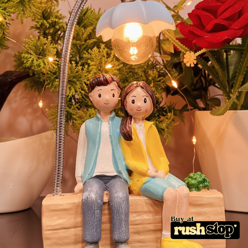 Lovely Couple Sitting Under LED Street Lamp Showpiece