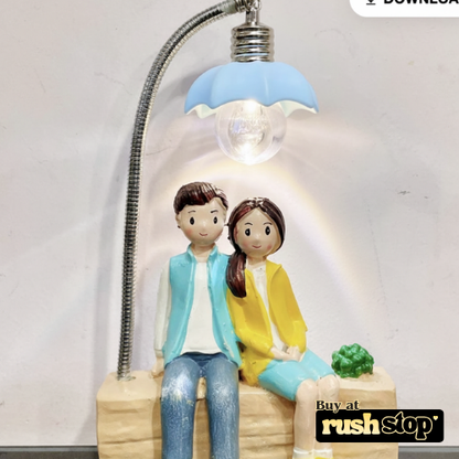 Lovely Couple Sitting Under LED Street Lamp Showpiece