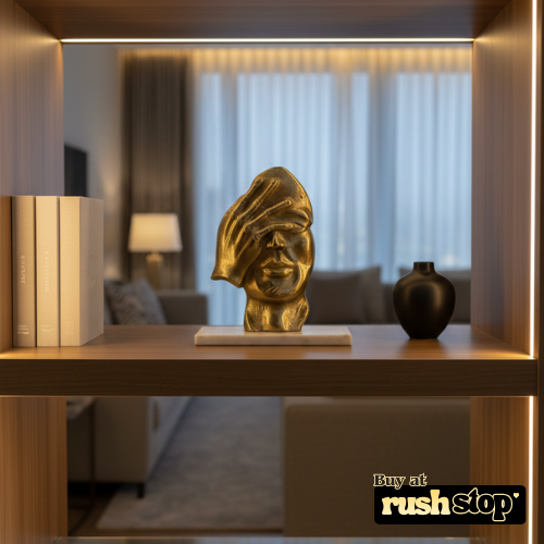 Modern golden thinker statue with hand covering face symbolizing deep thought