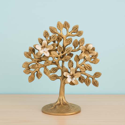 Bronze tree sculpture with flowers on a light blue background