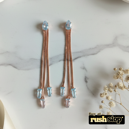 Rose gold multi chain crystal dangle earrings with blue and clear baguette crystals