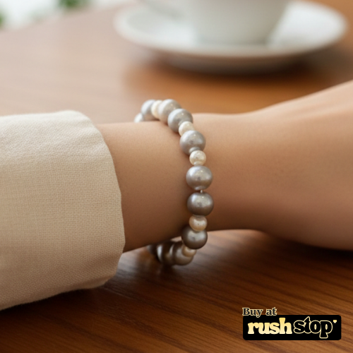 Handcrafted white and peach freshwater pearl bracelet with baroque center