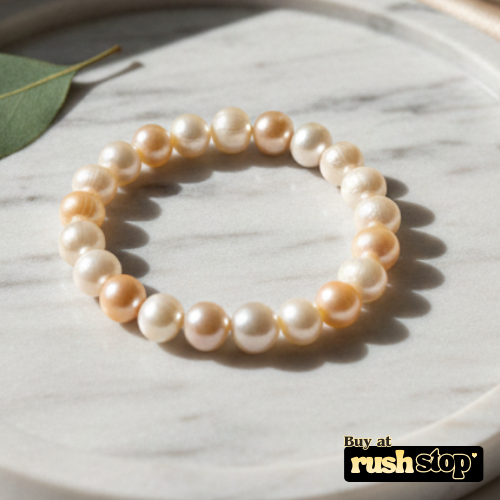 Handcrafted white and peach freshwater pearl bracelet with baroque center