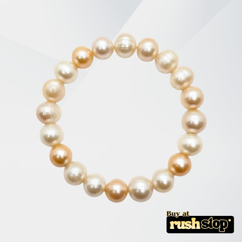 Handcrafted white and peach freshwater pearl bracelet with baroque center