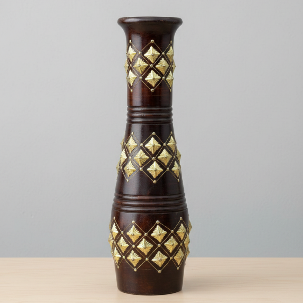 Decorative vase with gold geometric patterns on a gray background